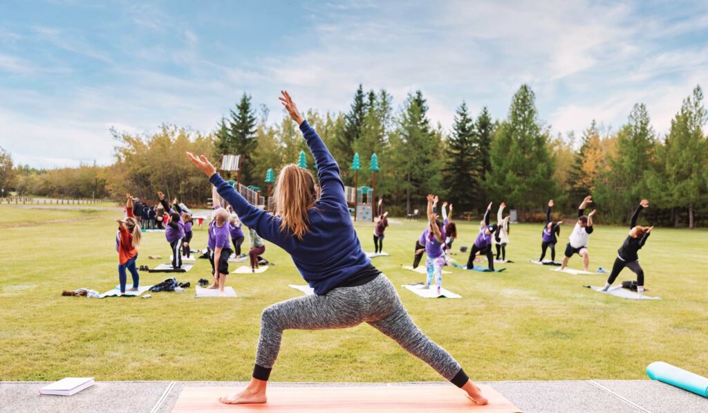 Group doing yoga outside